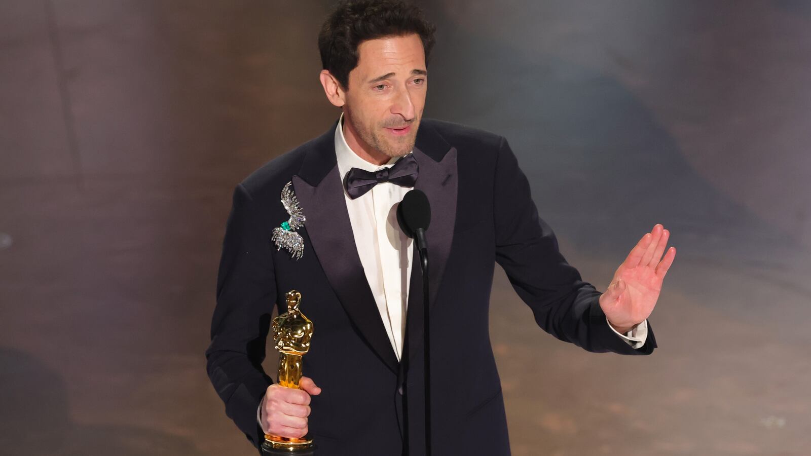 Adrien Brody accepts the Best Actor In A Leading Role award for "The Brutalist" onstage during the 97th Annual Oscars
