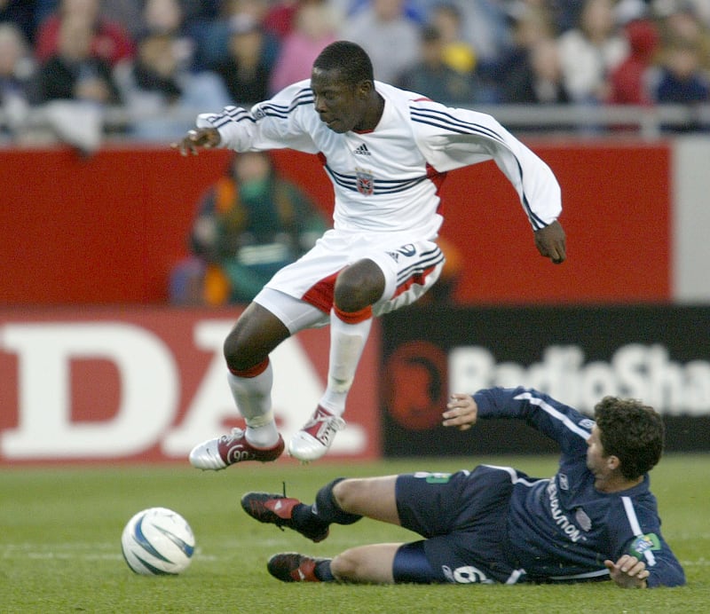DC United forward Freddy Adu jumps over New England Revolution defender Jay Heaps during the first half of the game at Gillette Stadium in Foxboro, Massachusetts, Saturday, May 29, 2004.