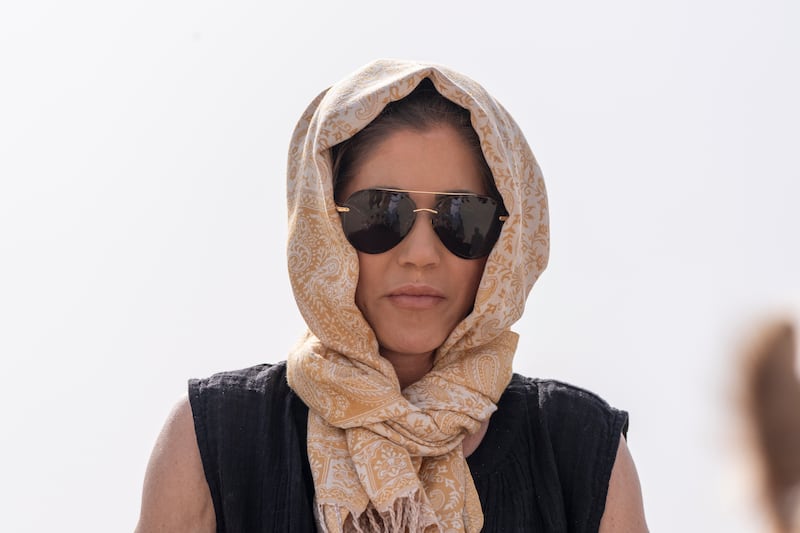 Homeland Security Secretary Kristi Noem rides a camel to a tour of Qal'at al-Bahrain Fort in Bahrain.