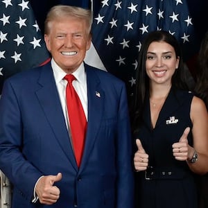 A photo of Julia Varvaro posing with Donald Trump.