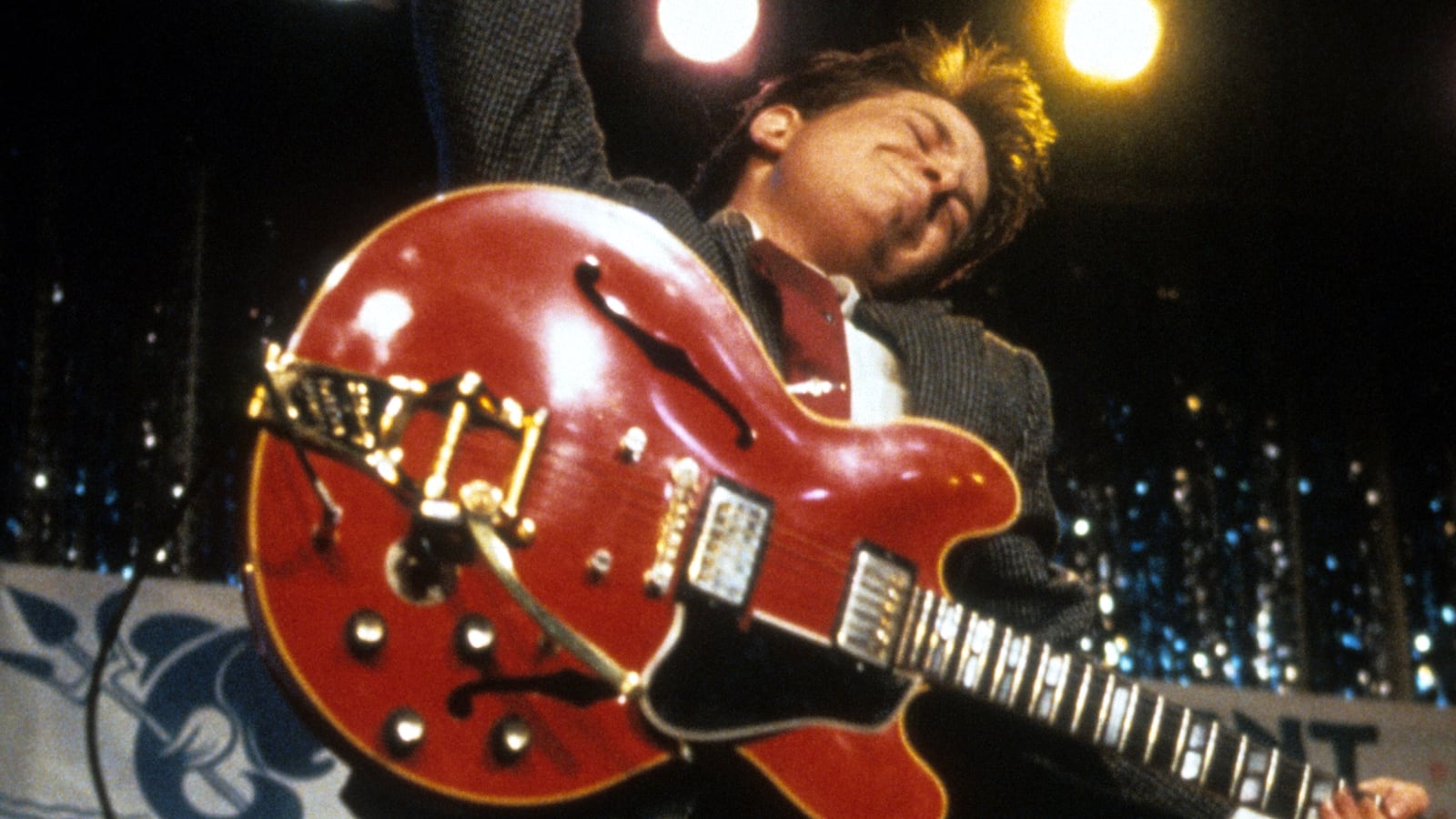 Michael J Fox leaping in air with guitar in a scene from the film 'Back To The Future', 1985. (Photo by Universal/Getty Images)