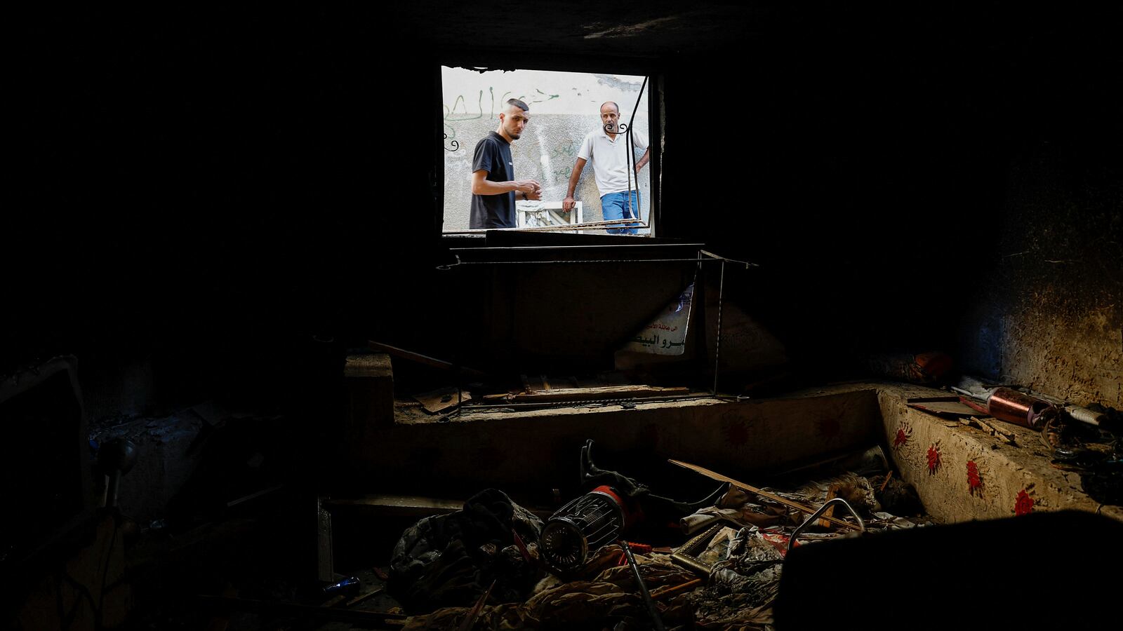 A Palestinian man looks on, as he checks the damage after an Israeli raid, in Jenin refugee camp in the Israeli-occupied West Bank, Nov. 3, 2023.