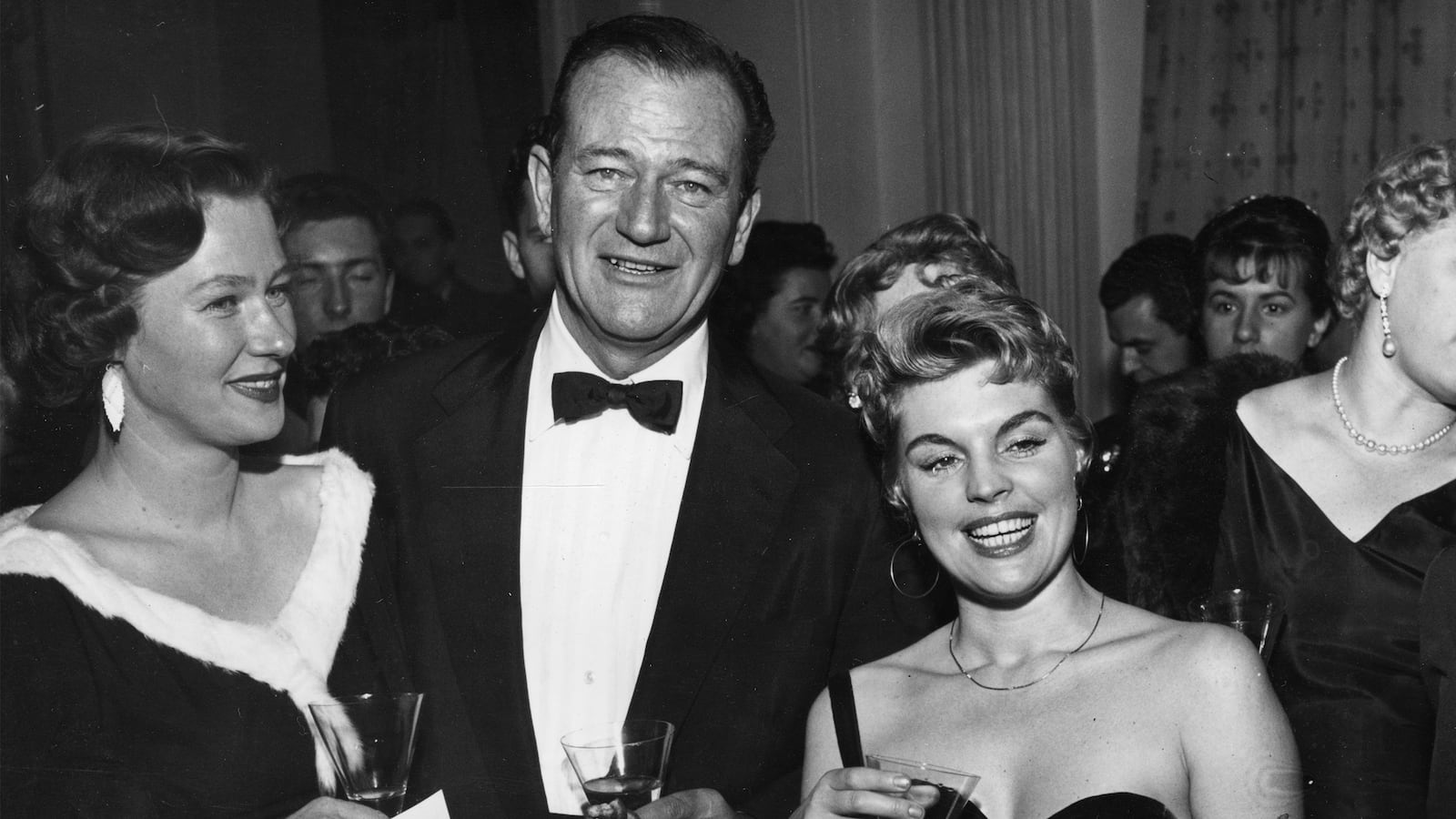 articles/2016/05/25/bourbon-tequila-and-dom-perignon-inside-john-wayne-s-liquor-cabinet/160524-rothbaum-john-wayne-drinks-tease_xmtazd