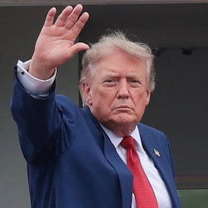 U.S. President Donald Trump waves as he boards Marine One as he departs SPIRE Academy, en route to Cleveland Hopkins International Airport, in Geneva, Ohio, U.S., August 11, 2026.