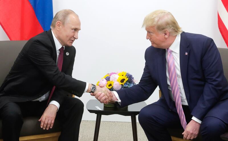 OSAKA, JAPAN - JUNE 28: (----EDITORIAL USE ONLY  MANDATORY CREDIT - "KREMLIN PRESS OFFICE  / HANDOUT" - NO MARKETING NO ADVERTISING CAMPAIGNS - DISTRIBUTED AS A SERVICE TO CLIENTS----) US President Donald Trump (R) meets Russian President Vladimir Putin (L) on the first day of the G20 summit in Osaka, Japan on June 28, 2019. (Photo by Kremlin Press Office / Handout/Anadolu Agency/Getty Images)