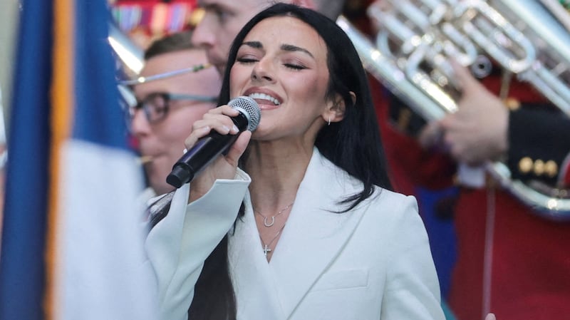 Alexis Wilkins sings the national anthem during a rally kicking off the Great American State Fair, marking the 250th anniversary of U.S. independence, on the National Mall in Washington, D.C., U.S., June 24, 2026. REUTERS/Jonathan Ernst
