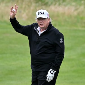 President Donald Trump reacts as he plays golf at the Trump Turnberry Golf Courses, in Turnberry on the south west coast of Scotland on July 27, 2025.