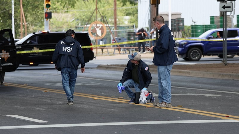 Federal officers investigate a reported ICE-related shooting in Austin, Texas.