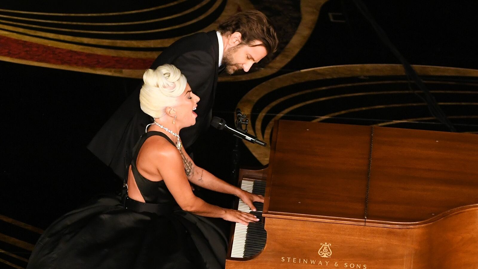 Lady Gaga and Bradley Cooper perform onstage at the iconic walnut Steinway during the 91st Annual Academy Awards in 2019.