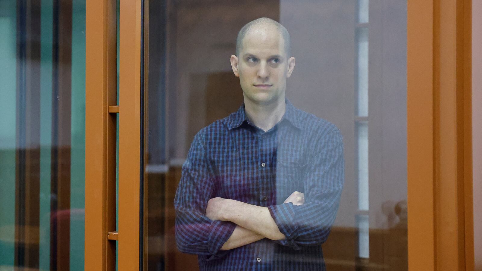 Wall Street Journal reporter Evan Gershkovich is seen inside an enclosure for defendants before a court hearing in Yekaterinburg, Russia June 26, 2024.