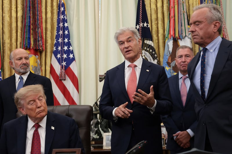 Oz speaks as Lutnick, Trump, and Kennedy look on during an event to address the White House's healthcare policies.