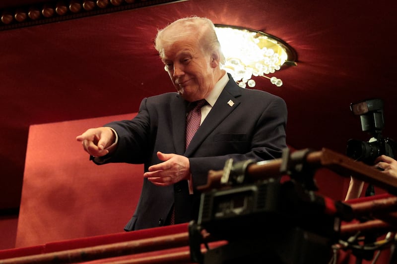 U.S. President Donald Trump gestures as he attends the opening night of 'Chicago' at the John F. Kennedy Memorial Center for the Performing Arts, renamed by the Trump administration to The Donald J. Trump and The John F. Kennedy Memorial Center for the Performing Arts, in Washington, D.C., U.S., March 31, 2026.