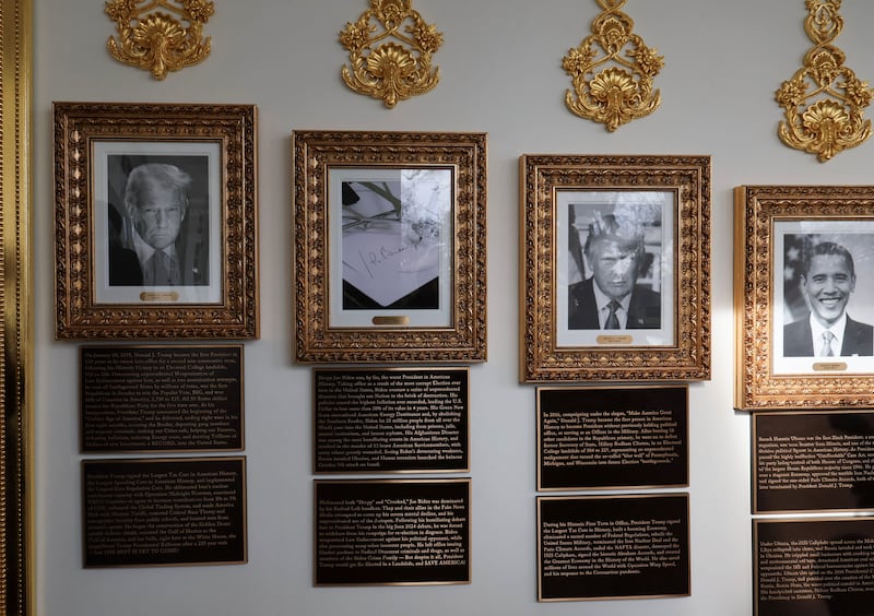 Portraits of U.S President Donald Trump and former U.S. President Barack Obama at the "Presidential Walk of Fame" at the White House, in Washington, D.C., U.S., December 17, 2025.