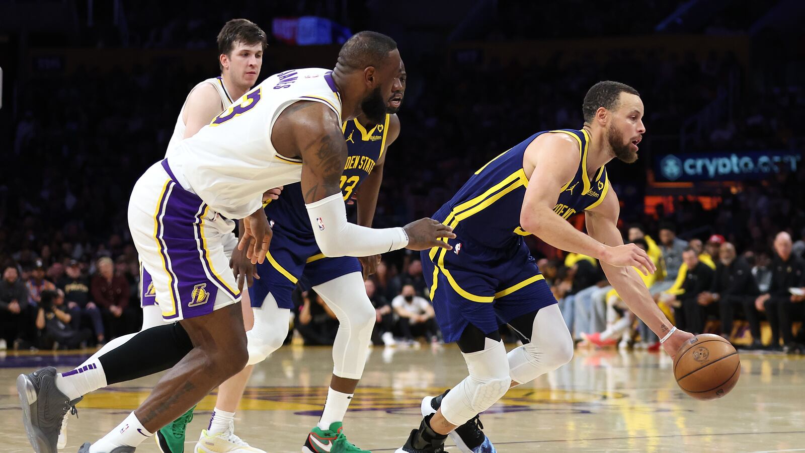 Stephen Curry #30 of the Golden State Warriors dribbles past the defense of LeBron James #23 of the Los Angeles Lakers during the second half of a game at Crypto.com Arena on March 16, 2024 in Los Angeles, California.