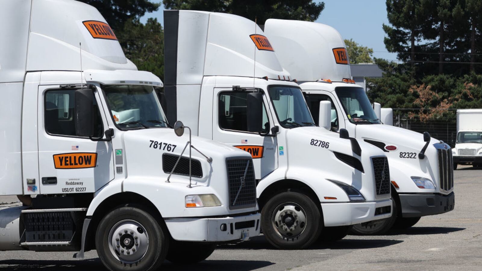 Yellow Corp. trucks sit idle at a company facility on July 31, 2023, in Hayward, California.