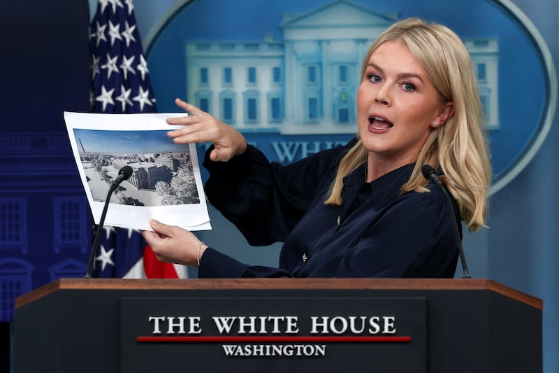 White House Press Secretary Karoline Leavitt holds an image of a rendering of the new White House ballroom to be built, during a press briefing at the White House in Washington, D.C., U.S., July 31, 2025. REUTERS/Evelyn Hockstein