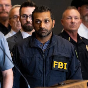 FBI director Kash Patel listens as Utah Department of Public Safety commissioner Beau Mason, left, speaks during a press conference at Utah Valley University