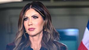 U.S. Secretary of Homeland Security Kristi Noem looks on during a press conference to discuss ongoing immigration enforcement efforts in Chicago