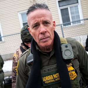 Border Patrol Chief Gregory Bovino (C) looks on as federal agents arrest a man on January 08, 2026 in Minneapolis, Minnesota.