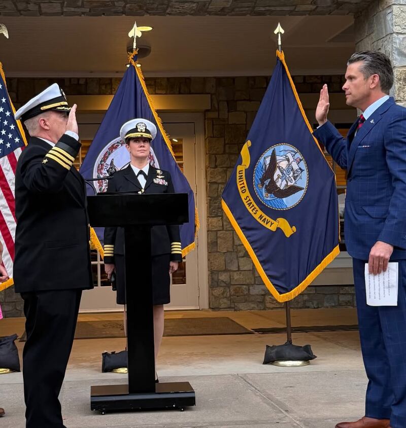 Spicer and Hegseth salute as the former Trump spox takes the oath of office.