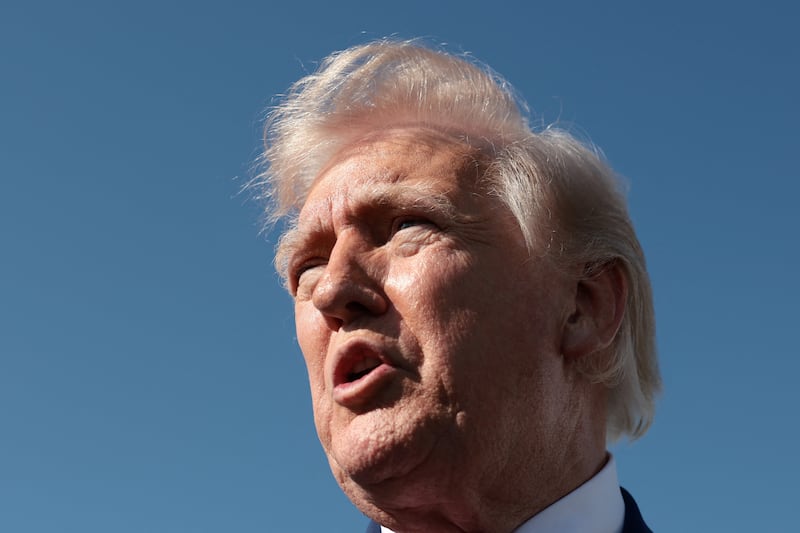 U.S. President Donald Trump speaks to the media, before boarding Air Force One on his way to Virginia, at Joint Base Andrews in Maryland, U.S., April 10, 2026.