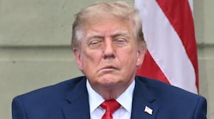 Donald Trump and first lady Melania Trump look on during a ceremony commemorating the 25th anniversary of the September 11th terrorist attacks in the courtyard of the Pentagon on September 11, 2026 in Arlington, Virginia.