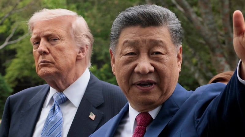 Chinese President Xi Jinping gestures as he greets U.S. President Donald Trump at Zhongnanhai Garden in Beijing, China, May 15, 2026.