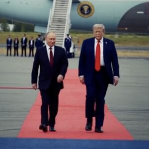 A screenshot from a video President Donald Trump posted about his meeting with Russian President Vladimir puting showing the pair walking on a red carpet in front of Air Foce One.