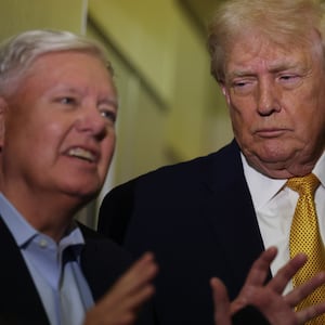 IN FLIGHT - JANUARY 04:  U.S. President Donald Trump (R) and U.S. Sen. Lindsey Graham (R-SC) speak to the media aboard Air Force One enroute to Washington, DC on January 04, 2026. Trump is returning to the White House after giving the order for the United States law enforcement to capture Venezuelan President Nicolás Maduro and his wife. (Photo by Joe Raedle/Getty Images)