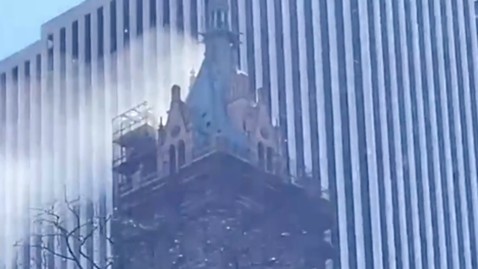 Smoke billowing from the top of the Sherry-Netherland hotel