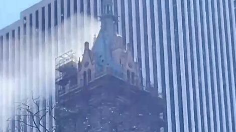 Smoke billowing from the top of the Sherry-Netherland hotel