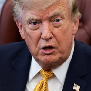 U.S. President Donald Trump answers questions from the media after signing an executive order establishing the President's Military Spouse Commission to be chaired by Jennifer Rauchet, wife of Secretary of Defense Pete Hegseth, in the Oval Office at the White House in Washington, D.C., U.S., August 3, 2026. REUTERS/Evelyn Hockstein