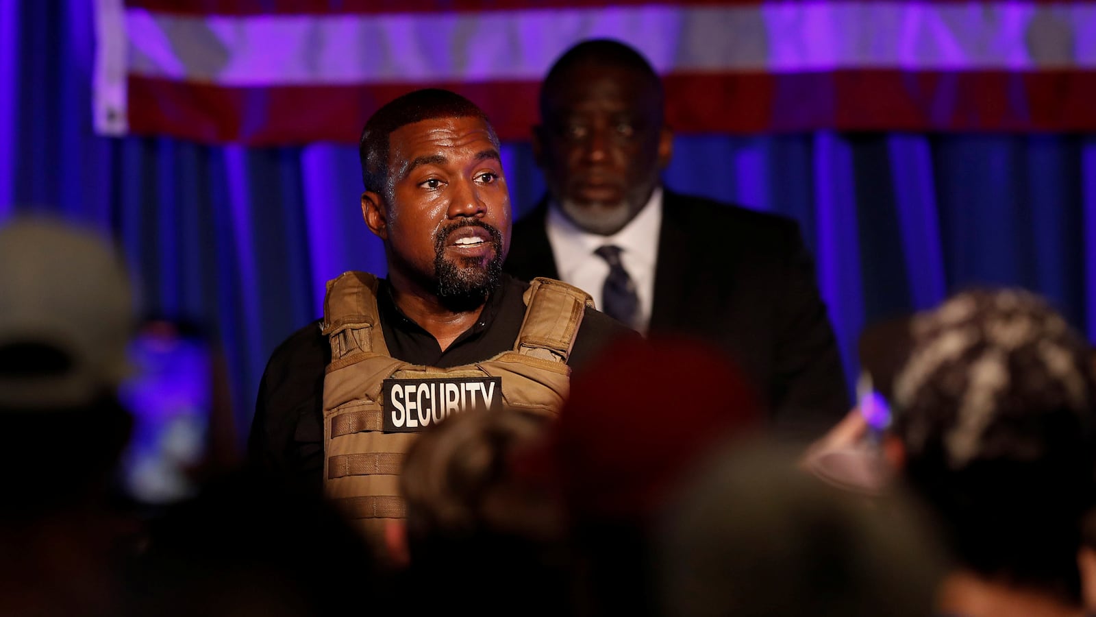 Kanye West speaking to a crowd.