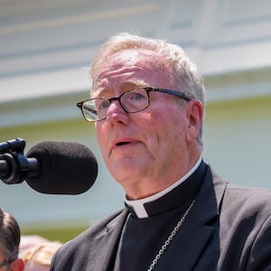 WASHINGTON, DC - MAY 01: Bishop Robert Barron (L), accompanied by U.S. President Donald Trump, and other religious leaders, speaks during a National Day of Prayer event in the Rose Garden at the White House on May 1, 2025 in Washington, DC. The National Day of Prayer is a congressionally recognized observance that calls on people of all faiths to participate in a day of prayer and reflection. (Photo by Andrew Harnik/Getty Images)