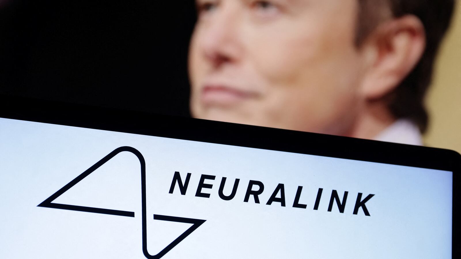 Neuralink logo and Elon Musk photo