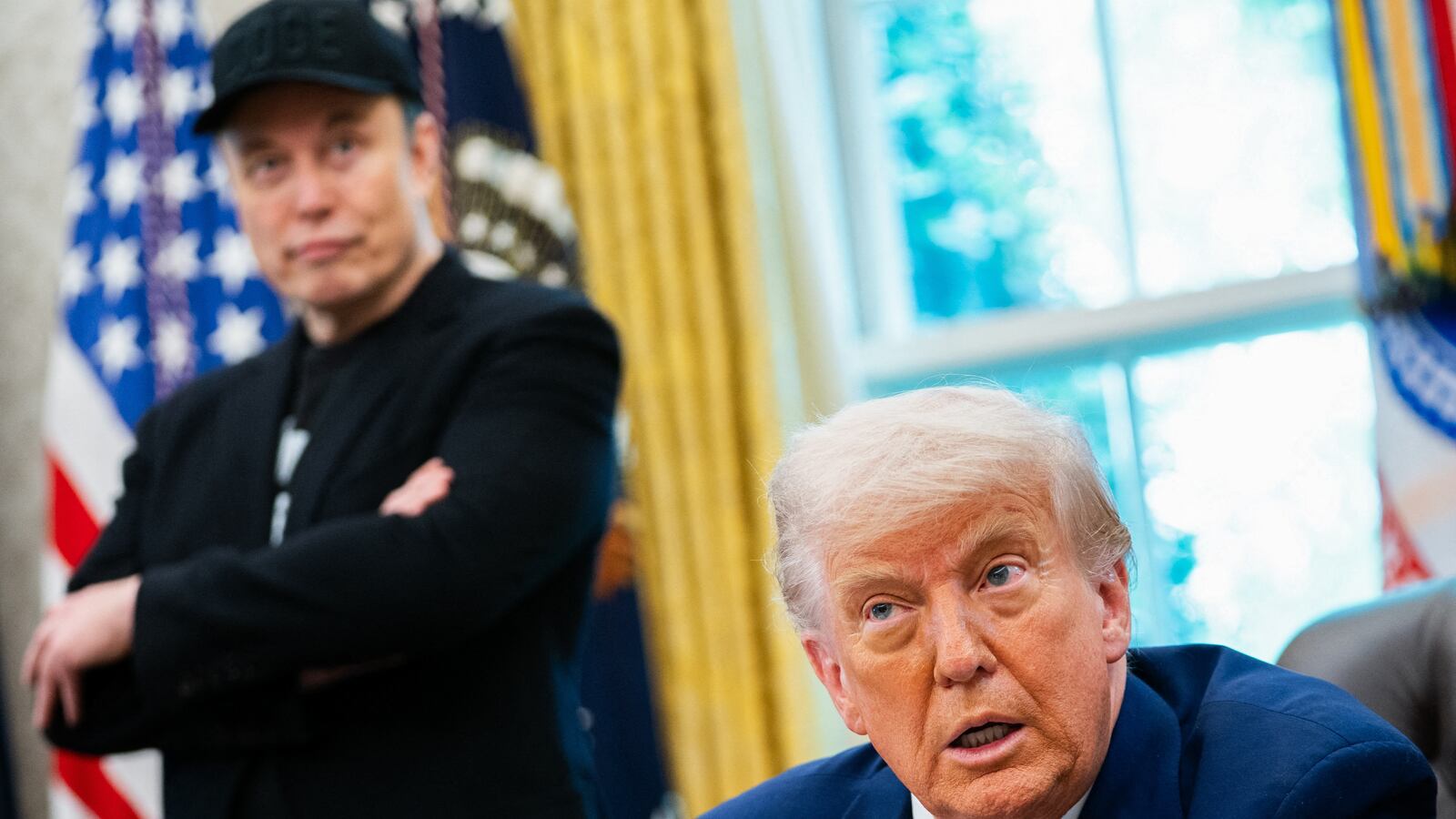US President Donald Trump speaks during a news conference with Elon Musk (L) in the Oval Office of the White House in Washington, DC, on May 30, 2025. Musk, who stormed into US politics as President Trump's chainsaw-brandishing sidekick, announced on May 28 that he is leaving his role in US government, intended to reduce federal spending, shortly after his first major break with the President over Trump's signature spending bill. (Photo by Allison ROBBERT / AFP) (Photo by ALLISON ROBBERT/AFP via Getty Images)