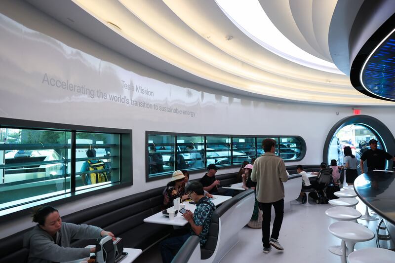 People dine inside during the opening of the Tesla Diner and Drive-In restaurant and Supercharger on Santa Monica Blvd in the Hollywood neighborhood Los Angeles, California on July 21, 2025. Elon Musk's electric vehicle company Tesla has opened a diner on Santa Monica Boulevard in Los Angeles. (Photo by Patrick T. Fallon / AFP) (Photo by PATRICK T. FALLON/AFP via Getty Images)
