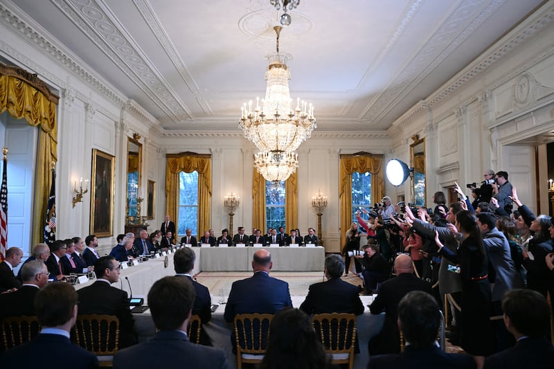 Journalists (R) ask questions as US President Donald Trump hosts a meeting with US oil company executives in the East Room of the White House in Washington, DC on January 9, 2026. President Trump is aiming to convince oil executives to support his plans in Venezuela, a country whose energy resources he says he expects to control for years to come. US forces seized Venezuelan president Nicolas Maduro in a sweeping military operation on January 3, with Trump making no secret that control of Venezuela's oil was at the heart of his actions. (Photo by Brendan SMIALOWSKI / AFP via Getty Images)