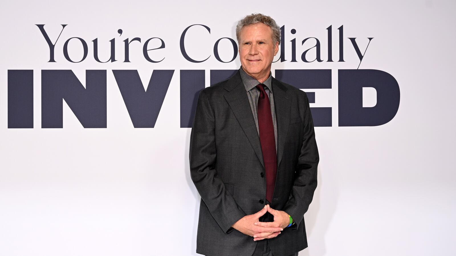 Will Ferrell stands and looks off to the side.