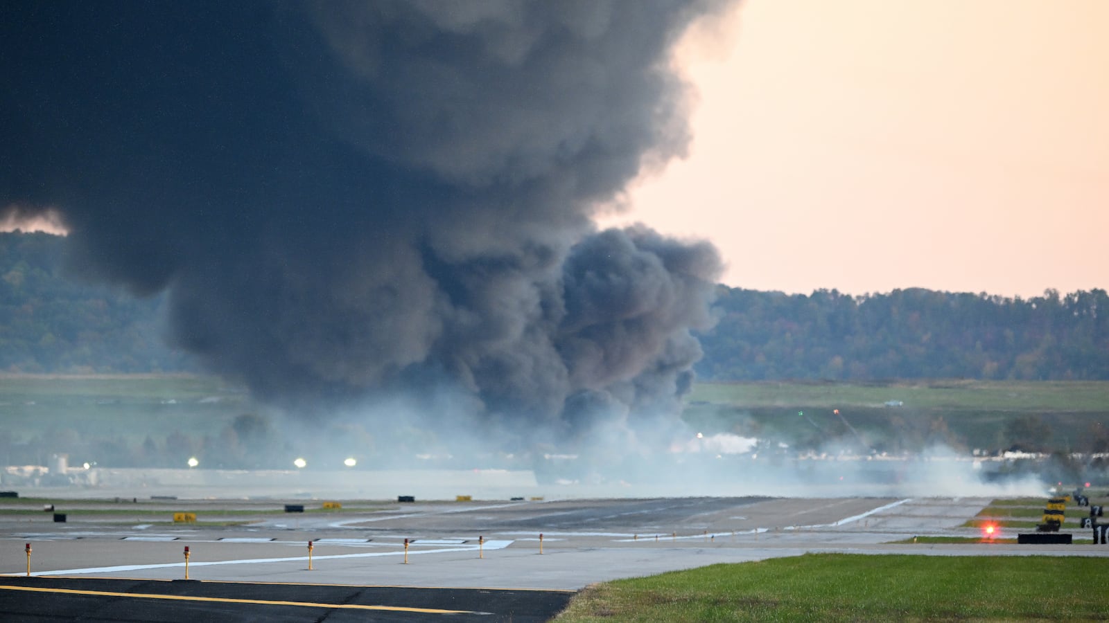 Fire and smoke mark where a UPS cargo plane crashed near Louisville Muhammad Ali International Airport on November 04, 2025 in Louisville, Kentucky.
