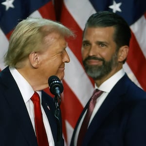 Donald Trump arrives to speak with Donald Trump Jr. during an election night event at the Palm Beach Convention Center on November 06, 2024 in West Palm Beach, Florida.