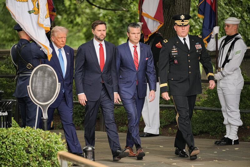 U.S. President Donald Trump, Vice President JD Vance, Defense Secretary Pete Hegseth and Major General Trevor J. Bredenkamp take part in ceremonies in commemoration of the Memorial Day holiday, at Arlington National Cemetery in Arlington, Virginia, U.S., May 26, 2025. REUTERS/Ken Cedeno