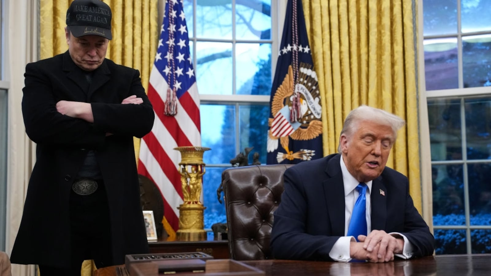 Elon Musk joins U.S. President Donald Trump during an executive order signing in the Oval Office.