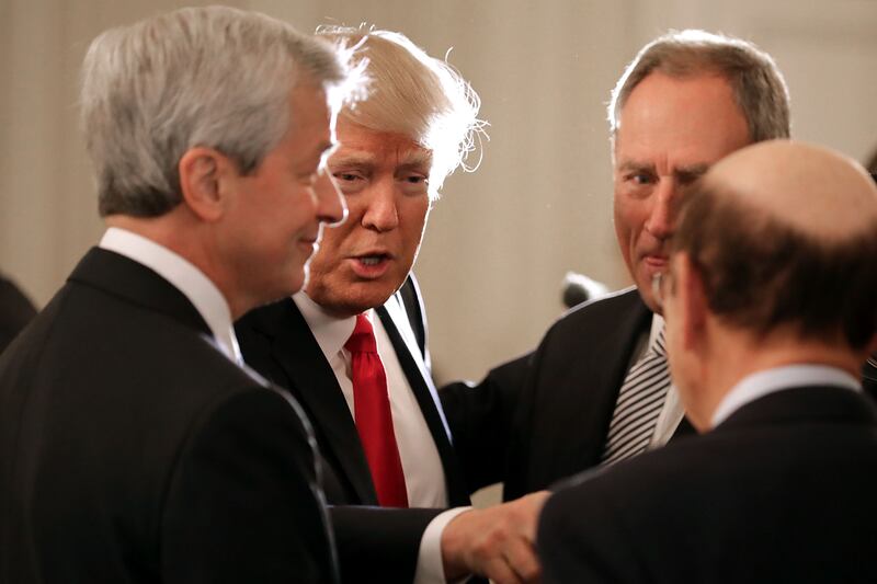 Jamie Dimon (left), Donald Trump (second-from-left), and two other guests.