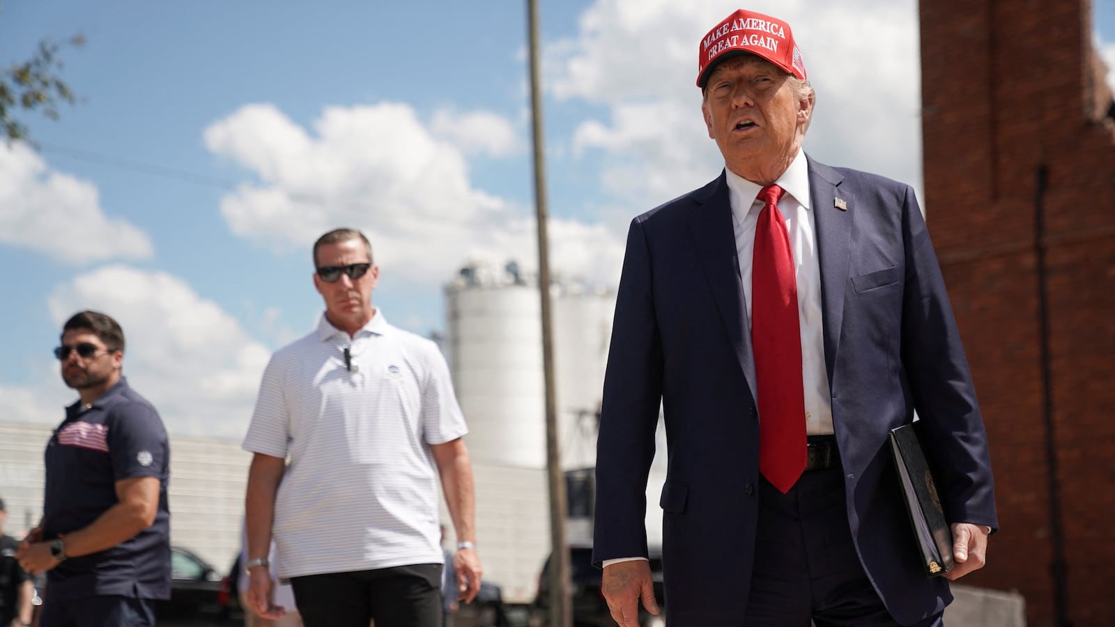 Donald Trump looks on as he attends an event about the damage caused by Hurricane Helene, in Valdosta, Georgia.