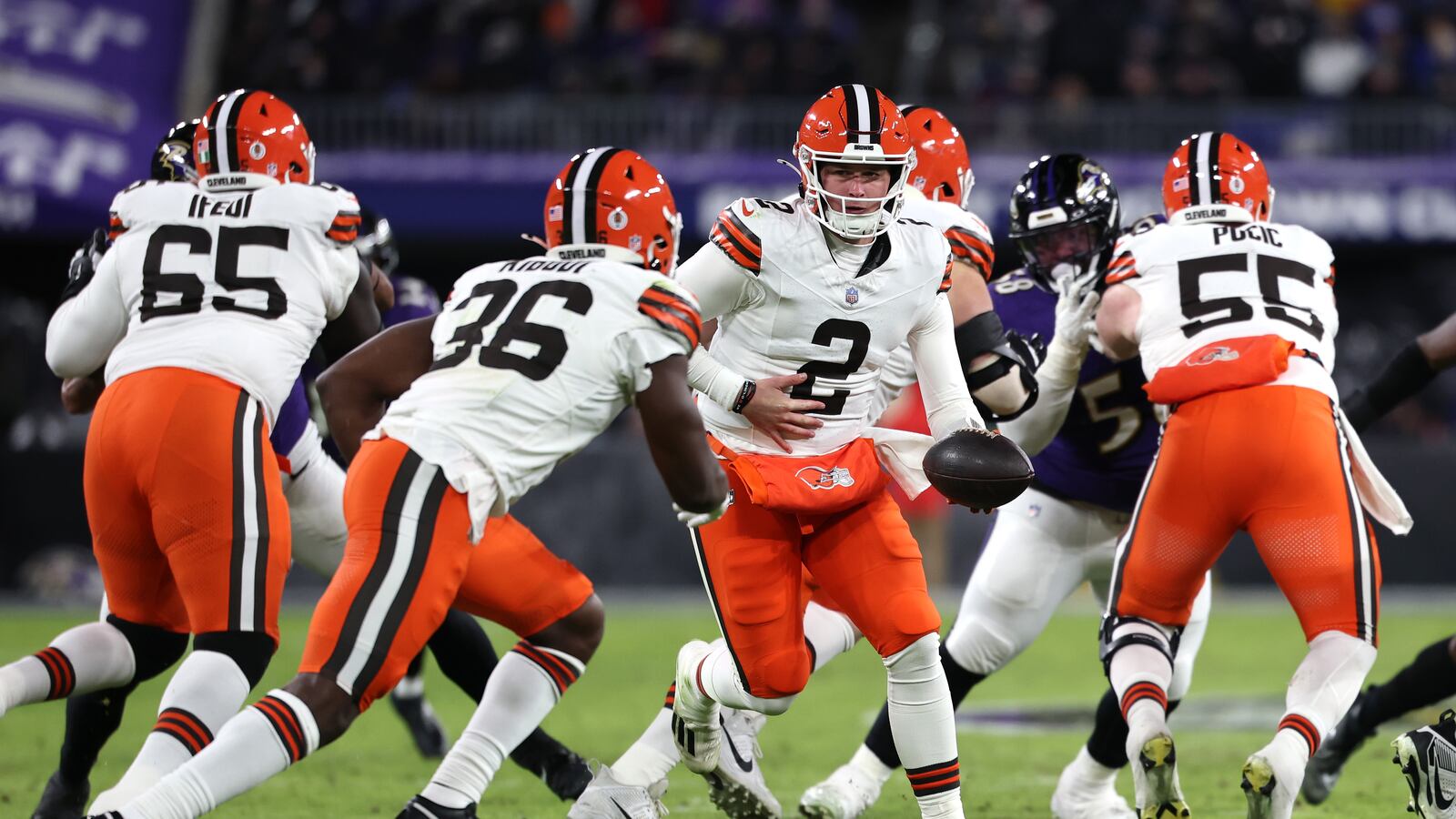 Bailey Zappe #2 of the Cleveland Browns hands the ball off to Jacob Kibodi #36 during the third quarter against the Baltimore Ravens at M&T Bank Stadium on January 04, 2025 in Baltimore, Maryland.