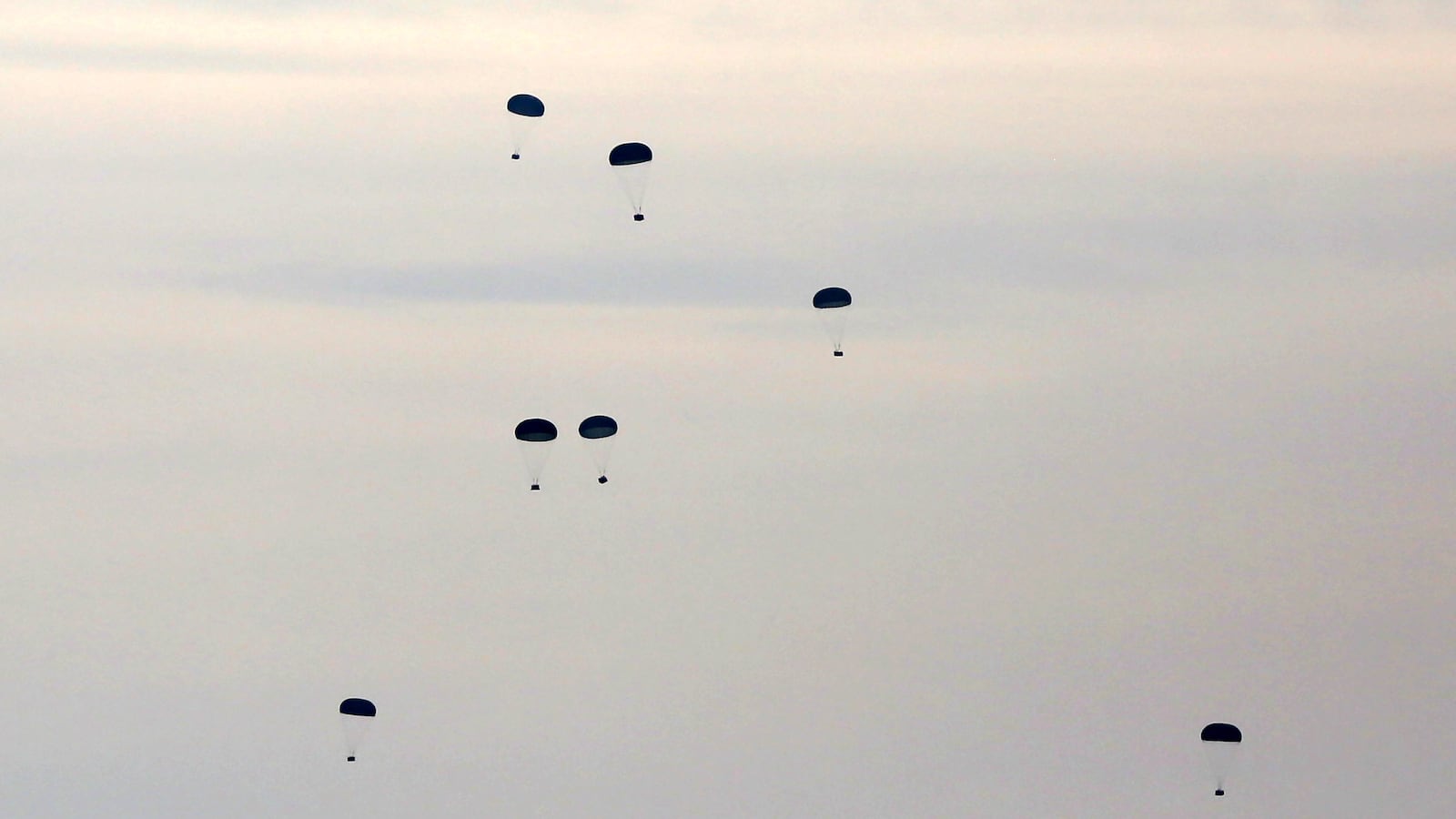 Cargo planes of Jordanian Armed Forces drop medical equipment supplies to the beach of Deir al Balah in Gaza Strip on February 26, 2024.