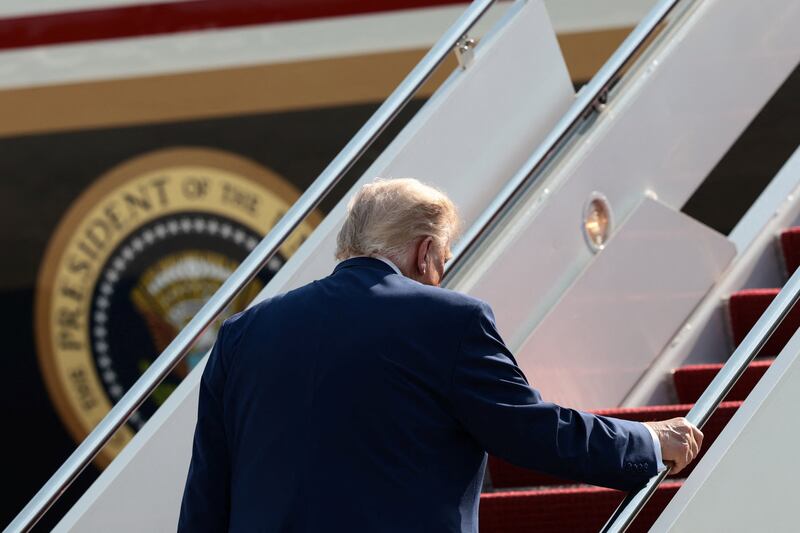 U.S. President Donald Trump boards Air Force One as he departs for Dover, Delaware, to attend the dignified transfer of U.S. Army service members killed in Jordan and Iraq, amid the Iran war, at Joint Base Andrews, Maryland, U.S., July 22, 2026.