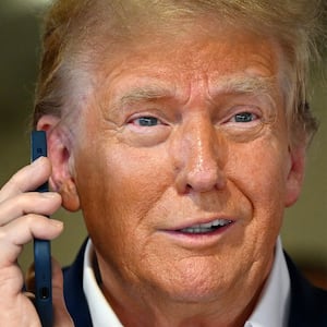 Donald Trump talks on the phone.