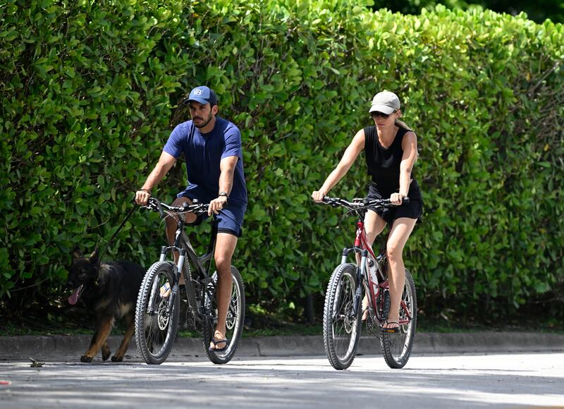 Joaquim Valente and Gisele Bündchen are seen on a bike ride in July 2024.